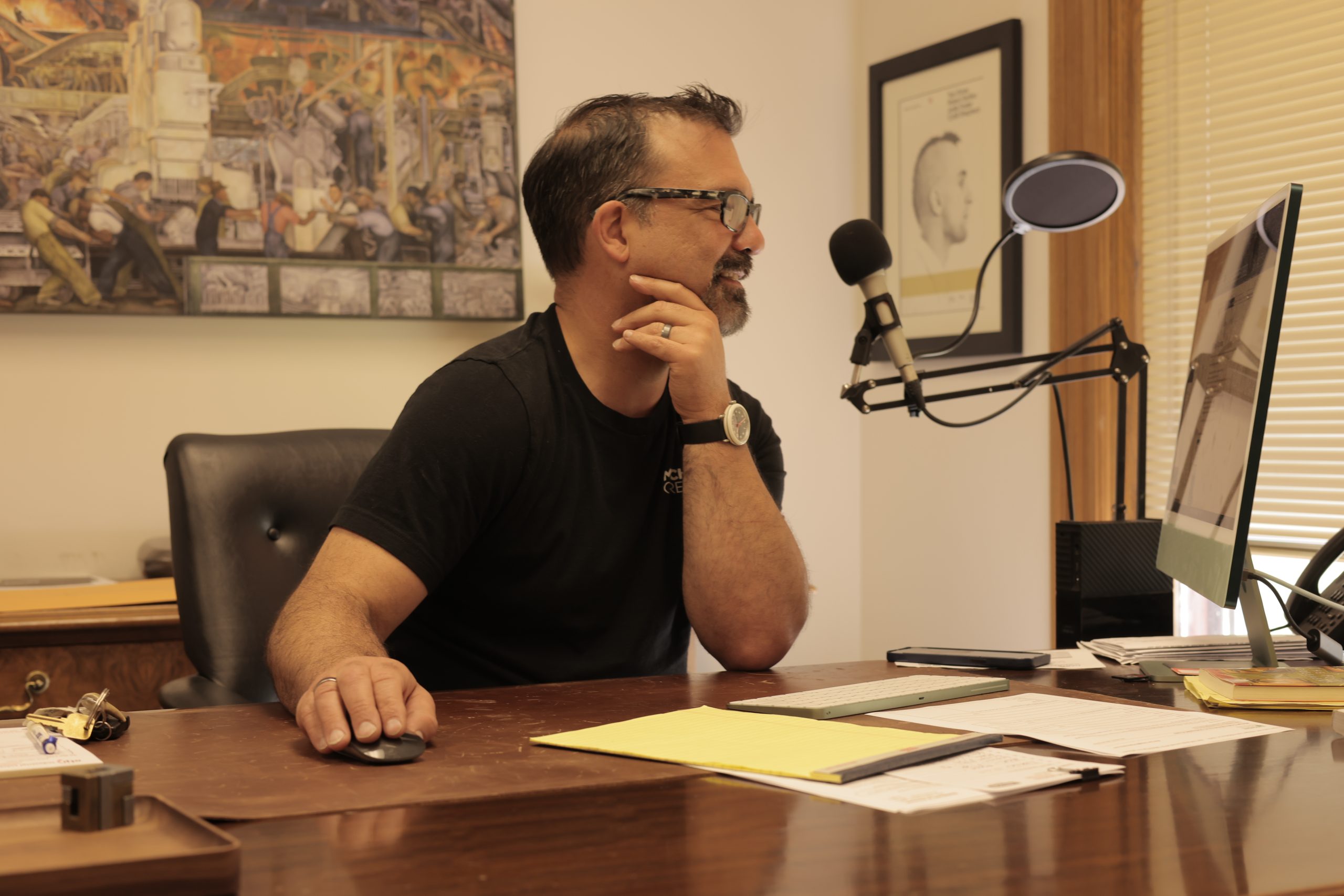 MC CEO Brian Town at his desk creating a marketing strategy