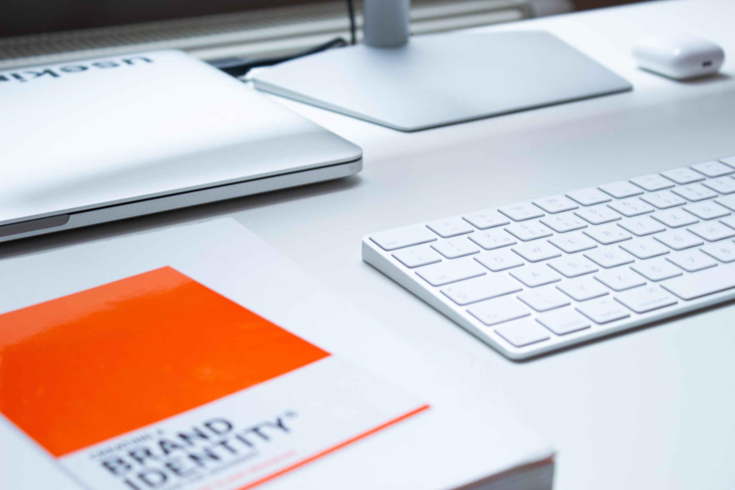 Orange Brand Standards Guide Book on Desk