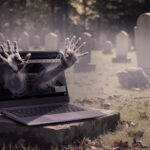 Ghostly hands coming from a Haunted Website and Computer in Graveyard